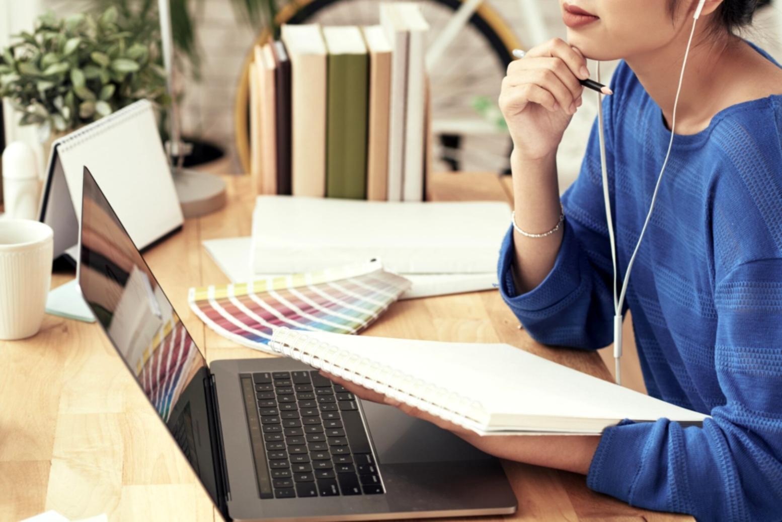 Business owner reviewing financial reports at desk